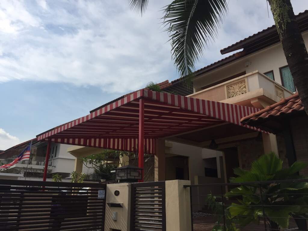 Fixed canopy over the car porch and driveway of a Malaysian bungalow