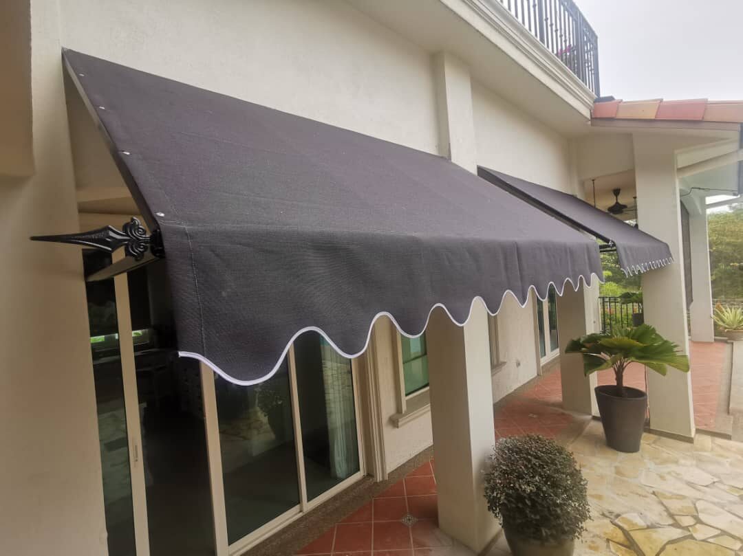 Fixed canopy over a covered walkway along a villa colonnade